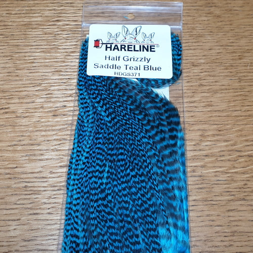 Hareline Grizzly Half Saddle – Teal Blue AVAILABLE AT TROUTLORE FLY TYING STORE AUSTRALIA