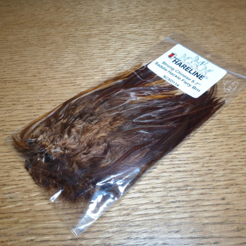 Hareline Strung Saddle Hackle 5-7 Inch Fiery Brown