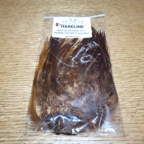 Hareline Strung Saddle Hackle 5-7 Inch Fiery Brown AVAILABLE AT TROUTLORE FLY TYING STORE AUSTRALIA